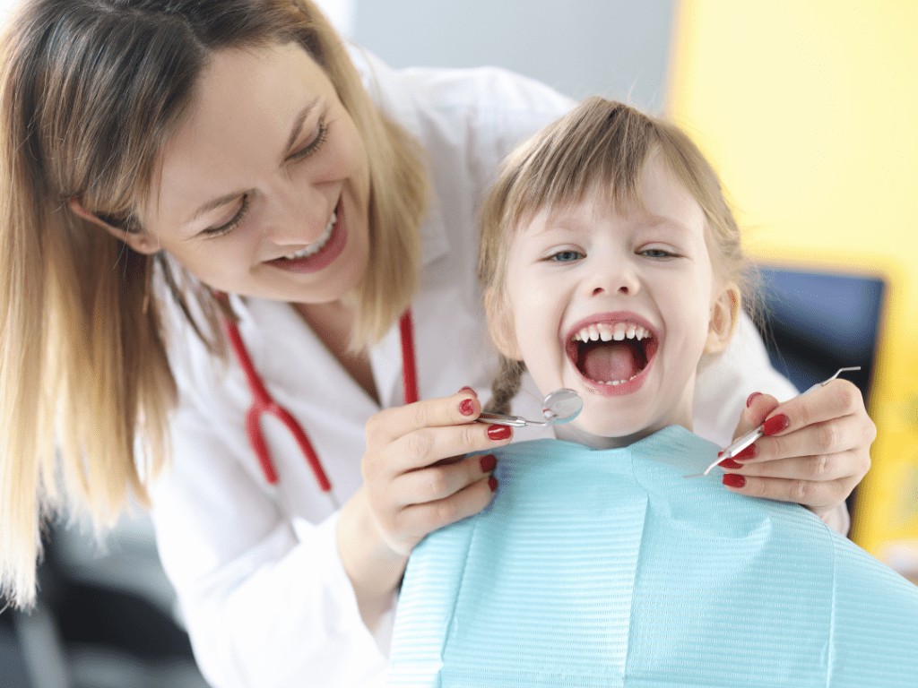 Dentist with child smiling